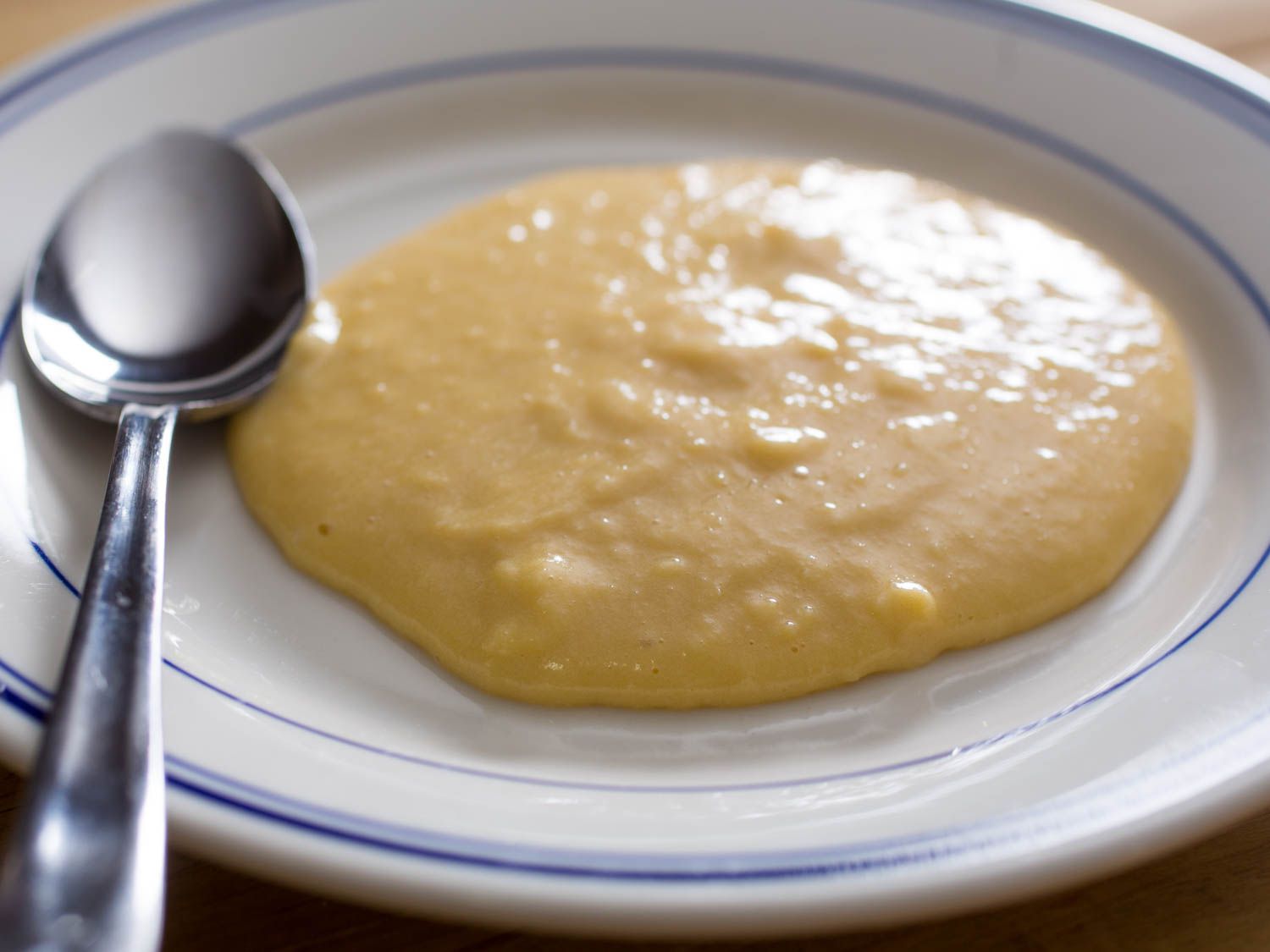 French-style eggs, custardy smooth, on a plate.