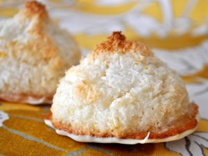 Closeup of white chocolate dipped lemon macaroons.