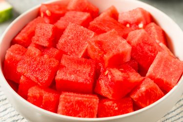 A bowl filled with diced watermelon pieces