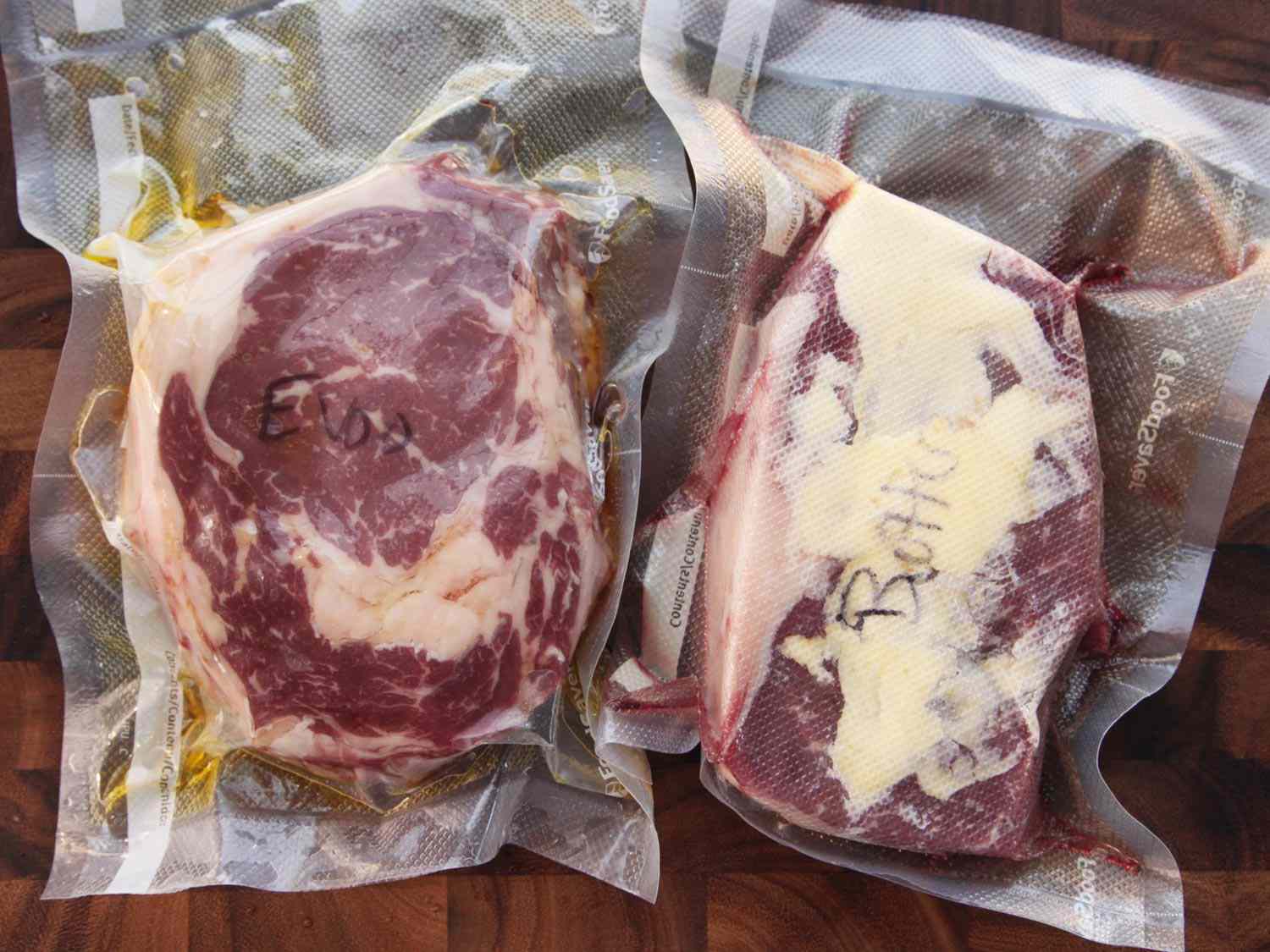Two steaks vacuum sealed in sous vide bags with butter added in one and olive oil added to the other.