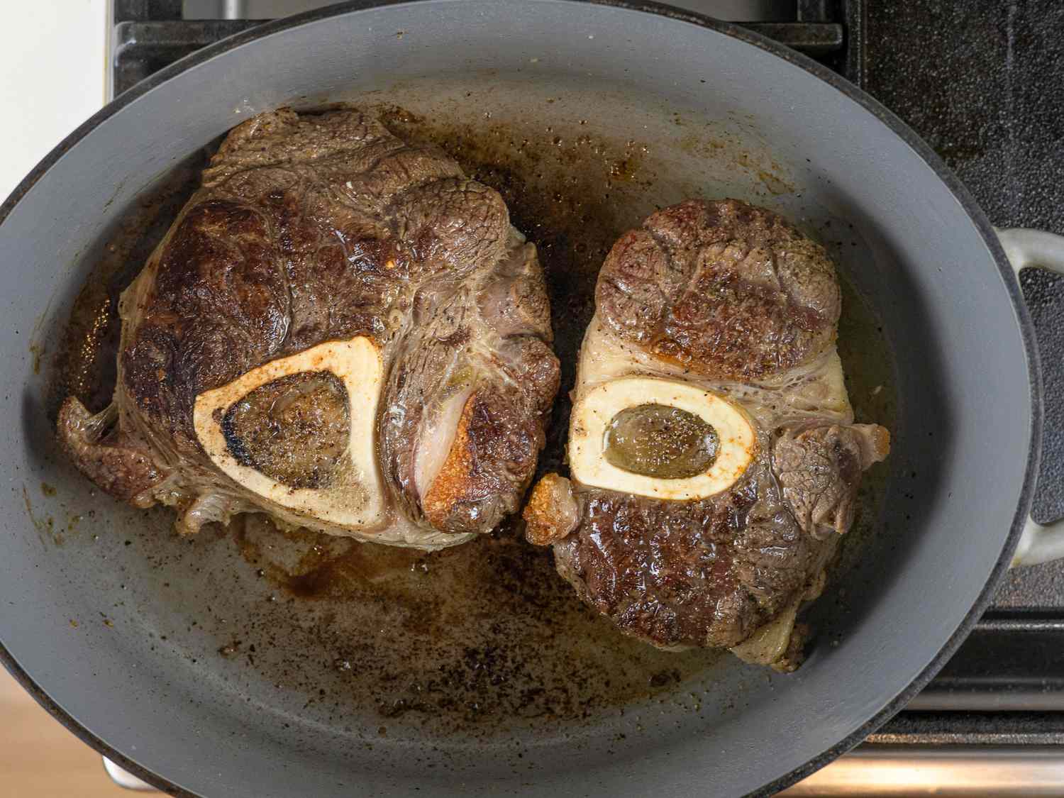 Beef shanks browning in a Dutch oven