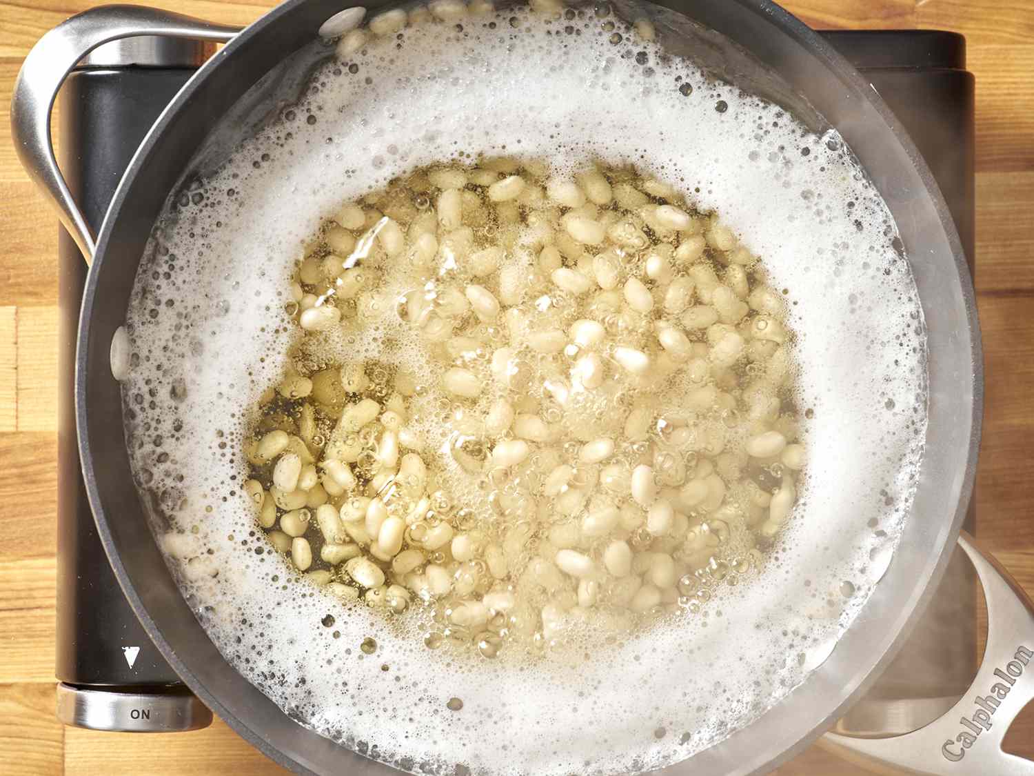 Beans soaking in a saucier.