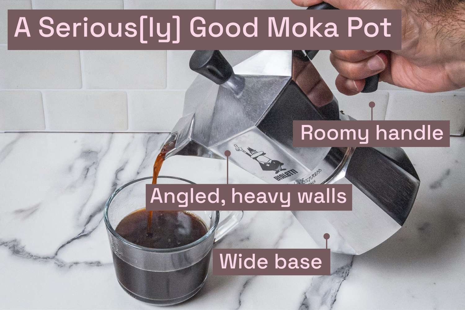 A person pouring from a moka pot into a glass mug