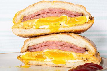 Stacked pork roll halved.