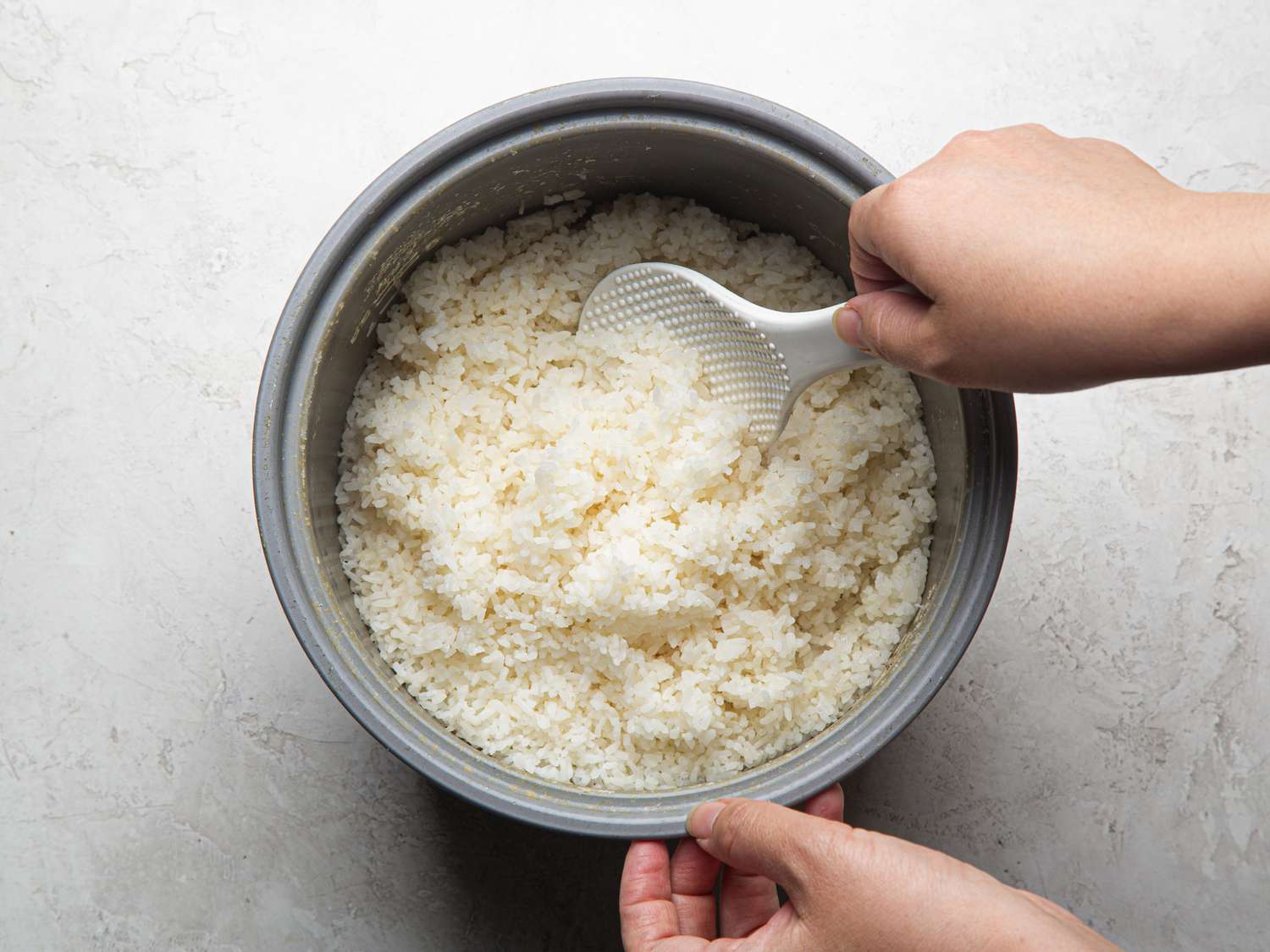 Overhead view of fluffing rice