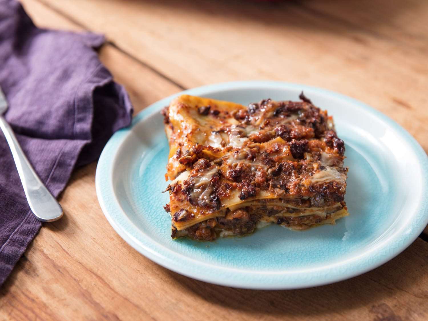 A slice of vegan lasagna on a serving plate. 