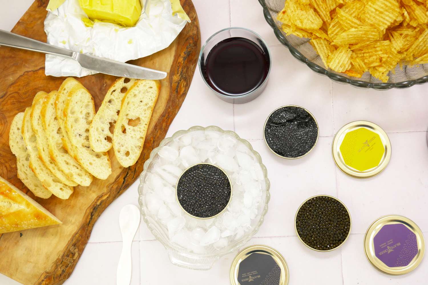 Island Creek Caviar Displayed on Table With Service Items