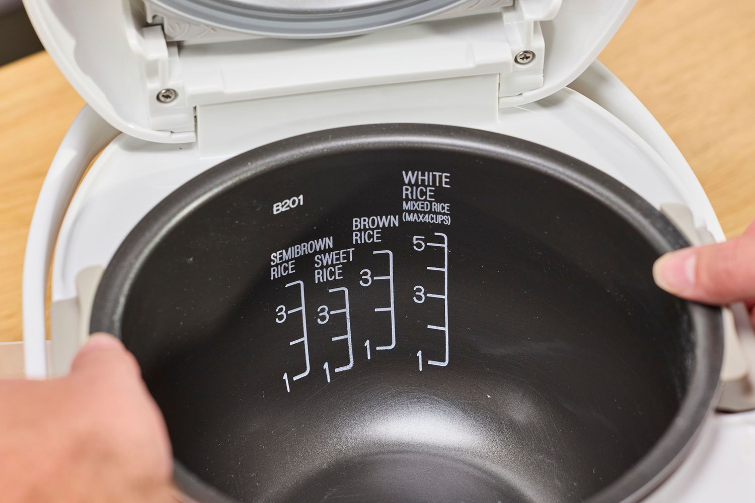 The measurements printed on the inside of the Zojirushi Neuro Fuzzy Rice Cooker and Warmer