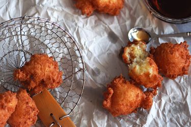 Closeup of Buñuelos de Yuca y Queso (Yuca and Cheese Fritters), fresh from the fryer.