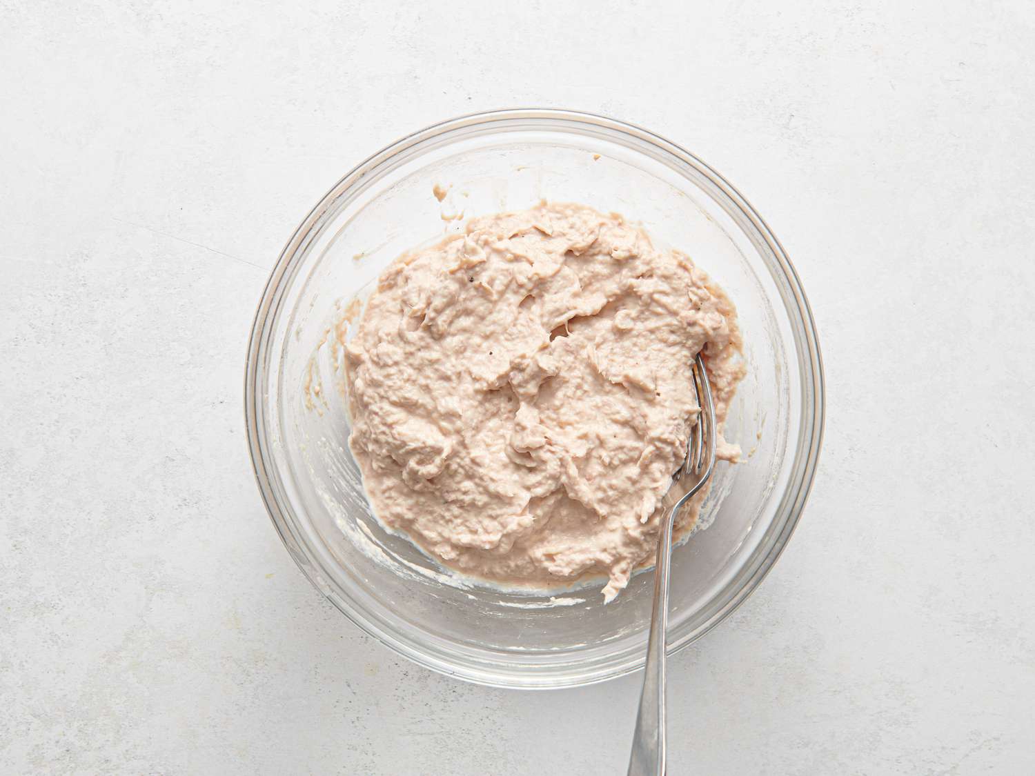 Tuna, mayonnaise, and panko stirred and mashed until well-combined inside a small mixing bowl