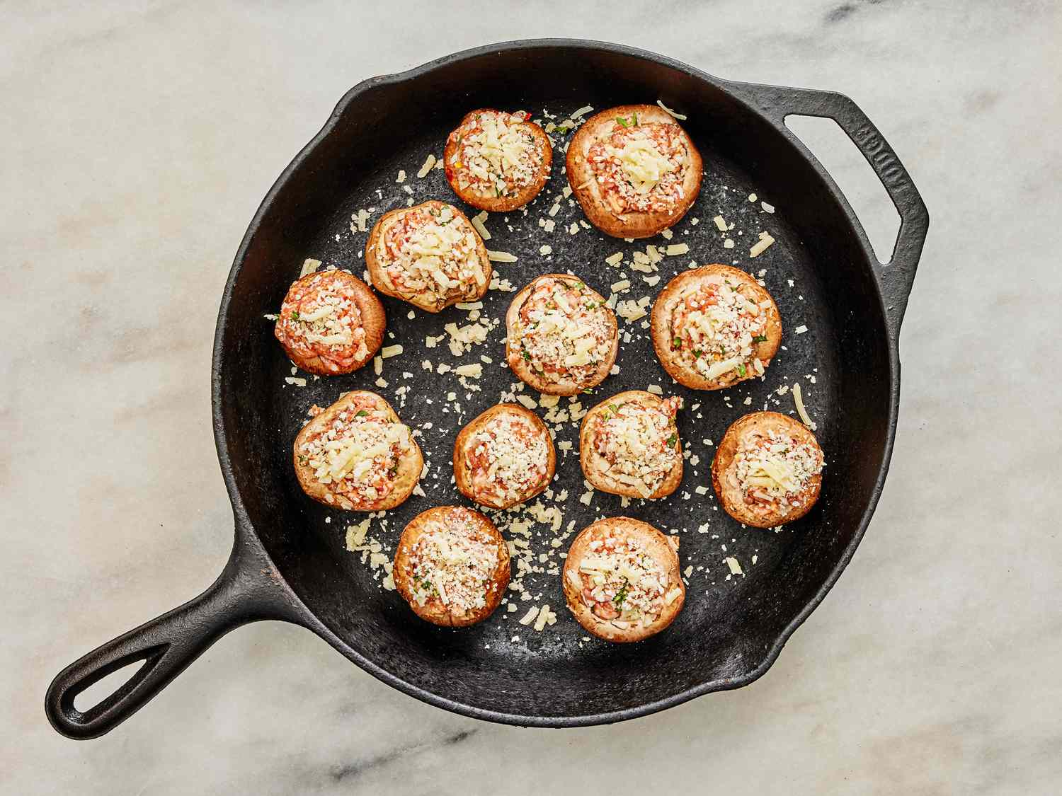 Stuffed Mushrooms in skillet, with panko and parmesan sprinkled on top 
