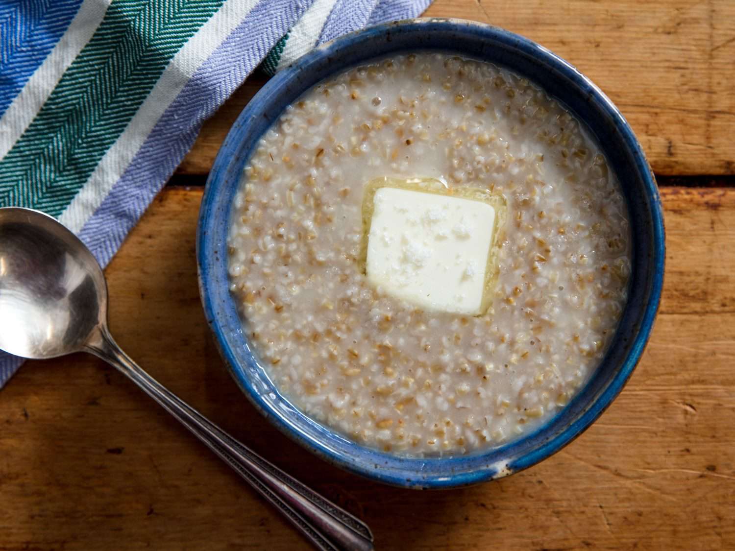 A bowl of Scottish oatmeal with butter.