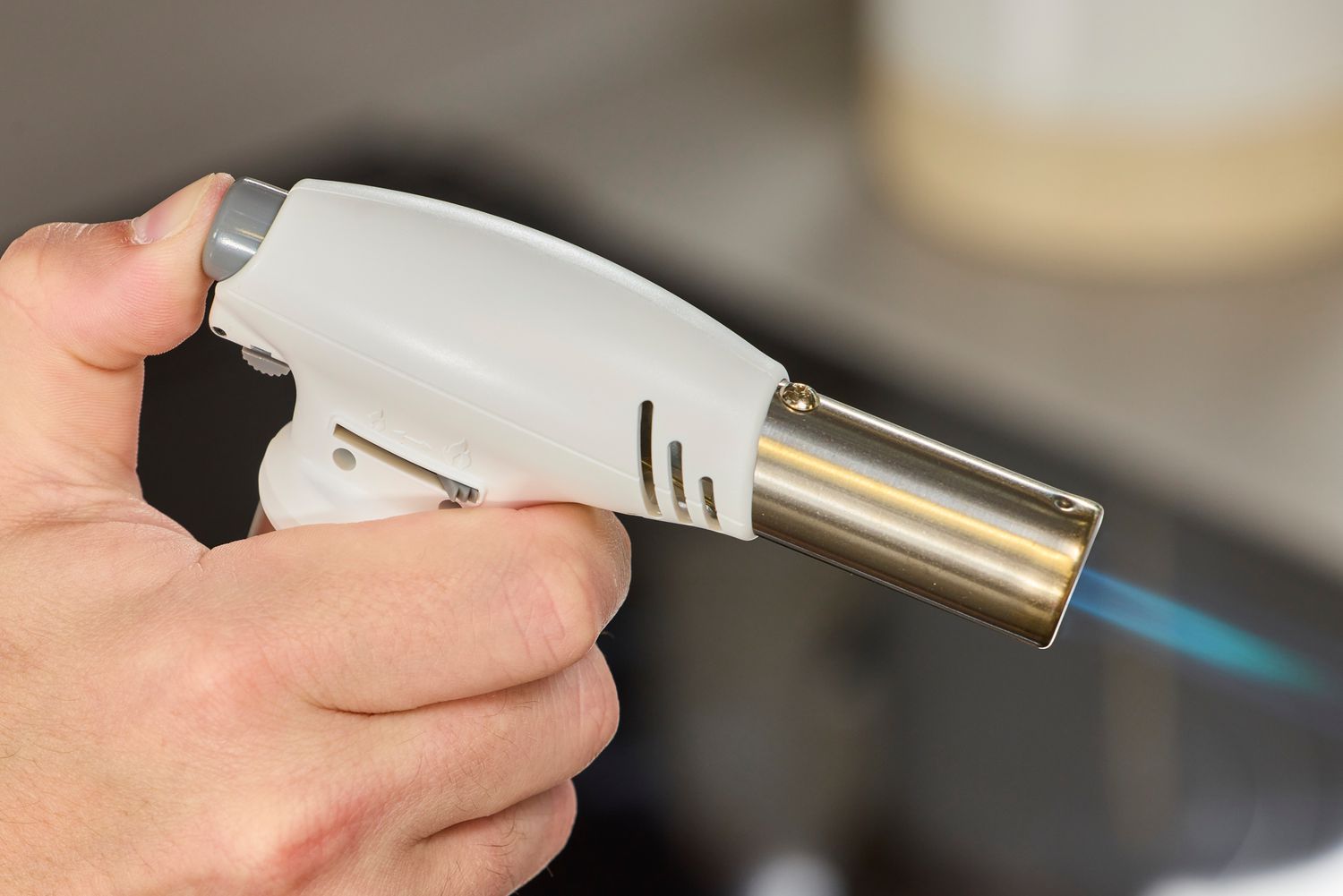 someone igniting the rosle kitchen torch