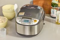 The Zojirushi NS-TSC10 Miacom Rice Cooker and Warmer on a kitchen countertop