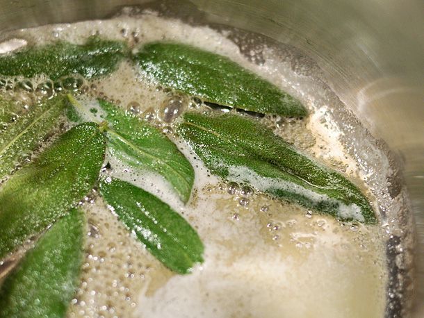 Sage leaves crisping in lightly browned butter. 