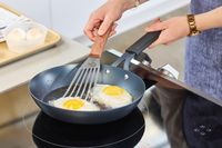 Eggs are cooked in the OXO Obsidian 10 Inch Pre-Seasoned Carbon Steel Frying Pan