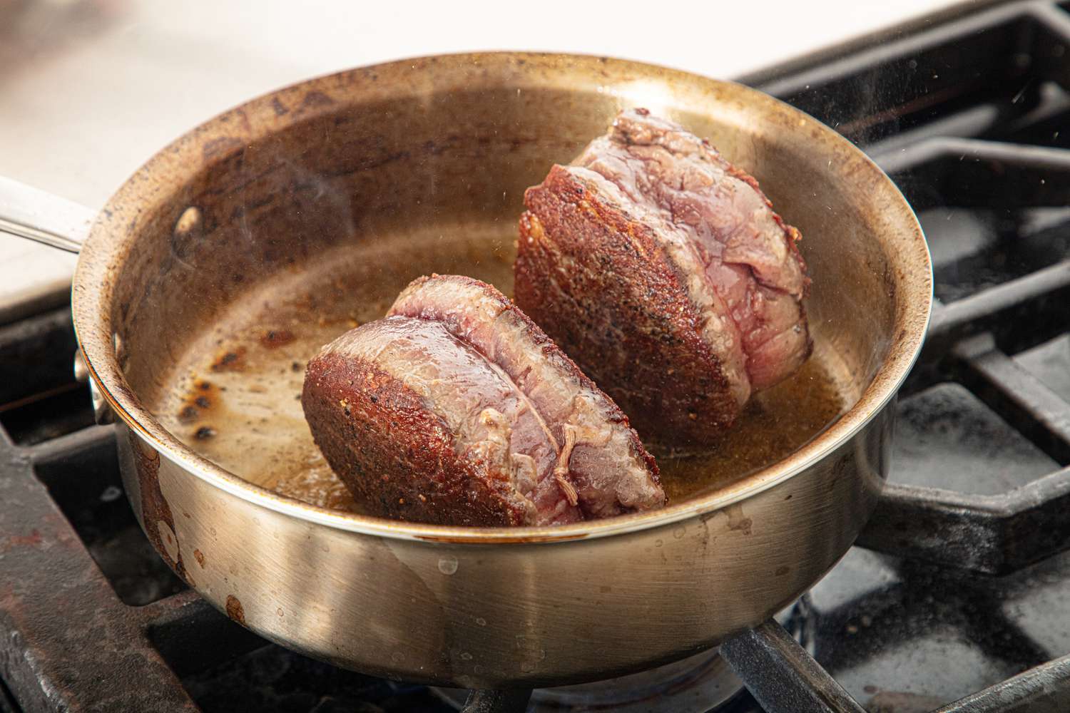 Steaks searing on their sides