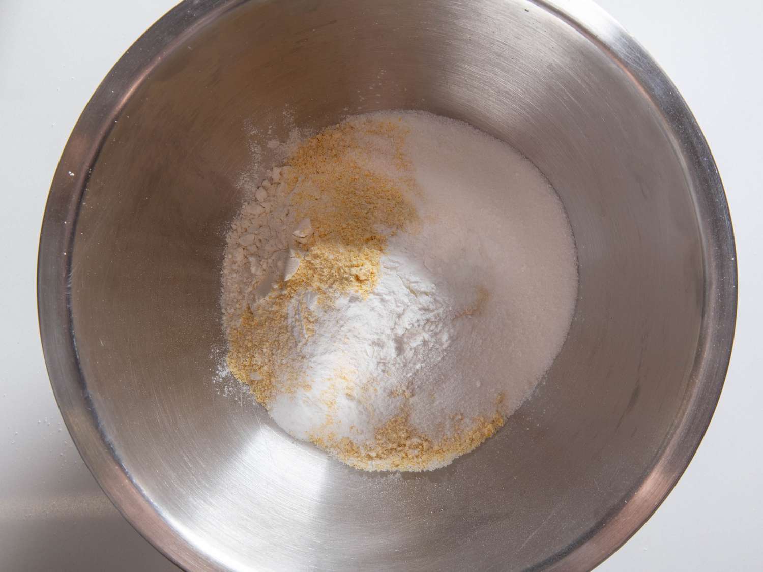 Dry mix for cornbread muffins in a mixing bowl