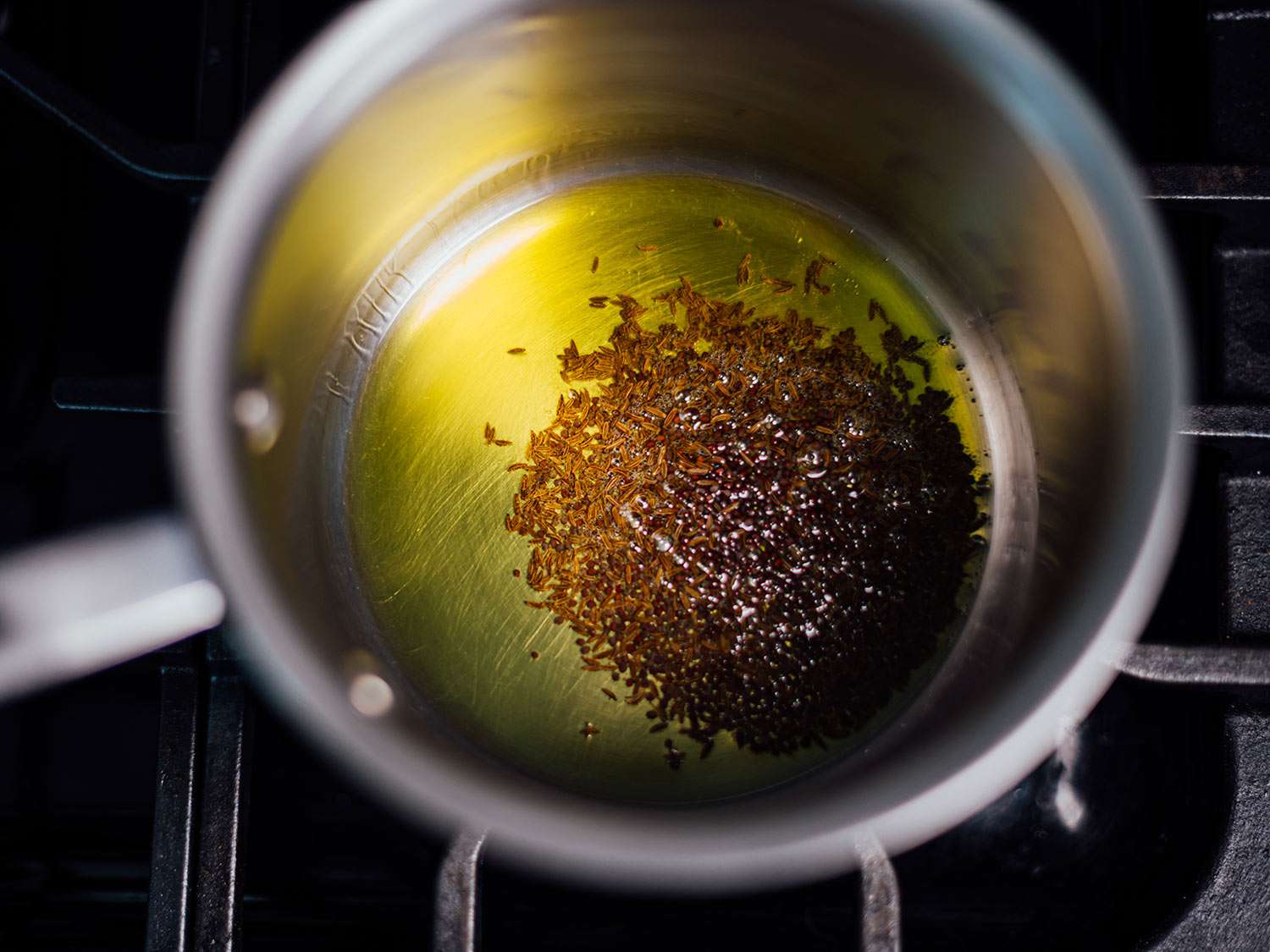 Spices in hot oil before they start to bloom