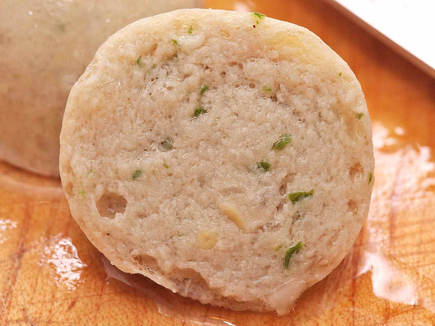 A slice of sausage that contains too much water. It looks watery.