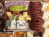 A closeup on cheeses and meats from the Boarderie charcuterie board