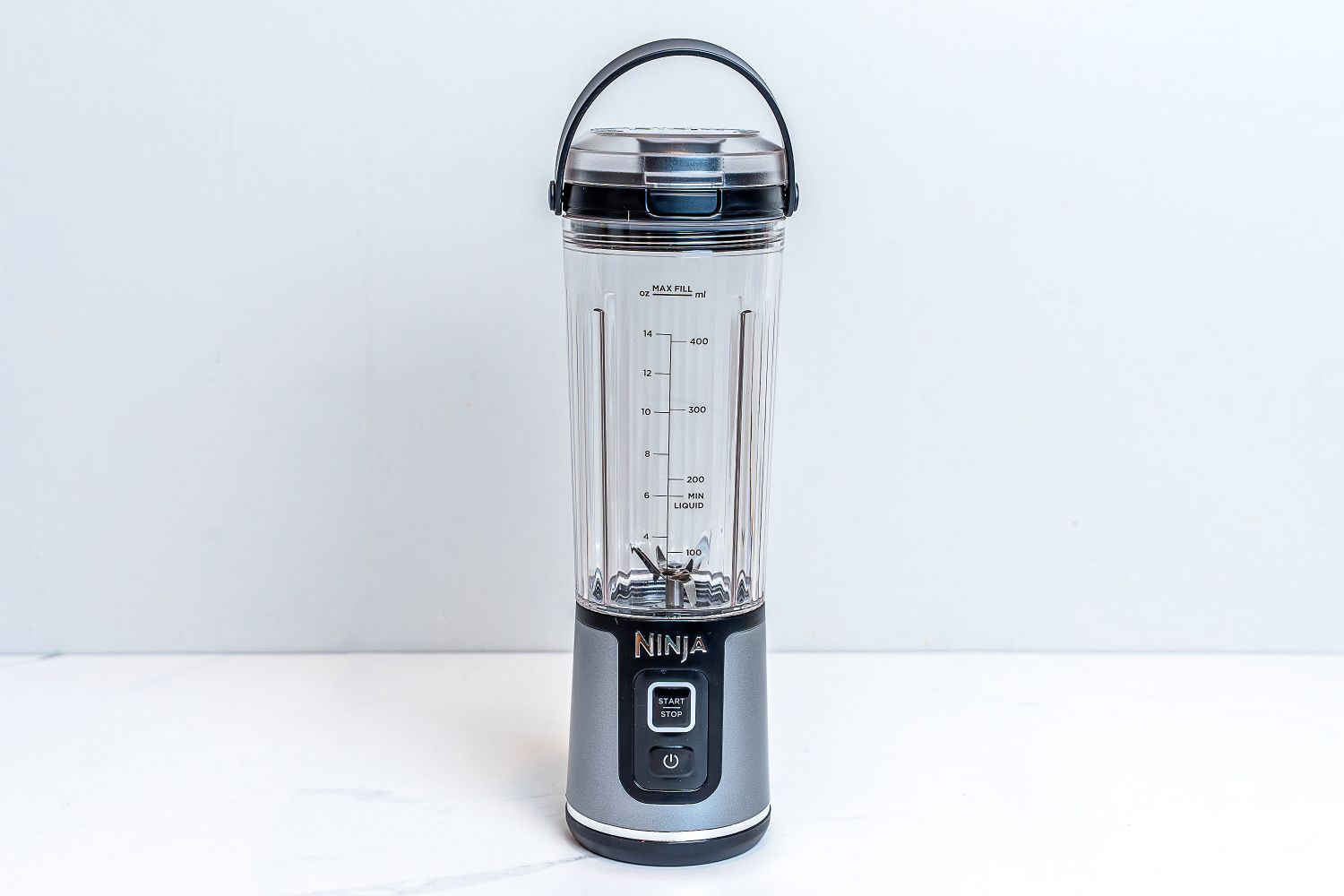 Empty Ninja Blast Portable Blender on white countertop