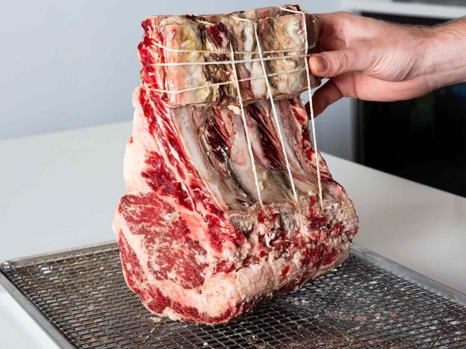 Shio koji-marinated prime rib on a wire rack-lined baking sheet.