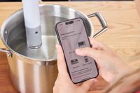 A person controls the Breville Joule Turbo Sous Vide using their smartphone