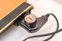 A closeup of the temperature dial on the Crux electric griddle