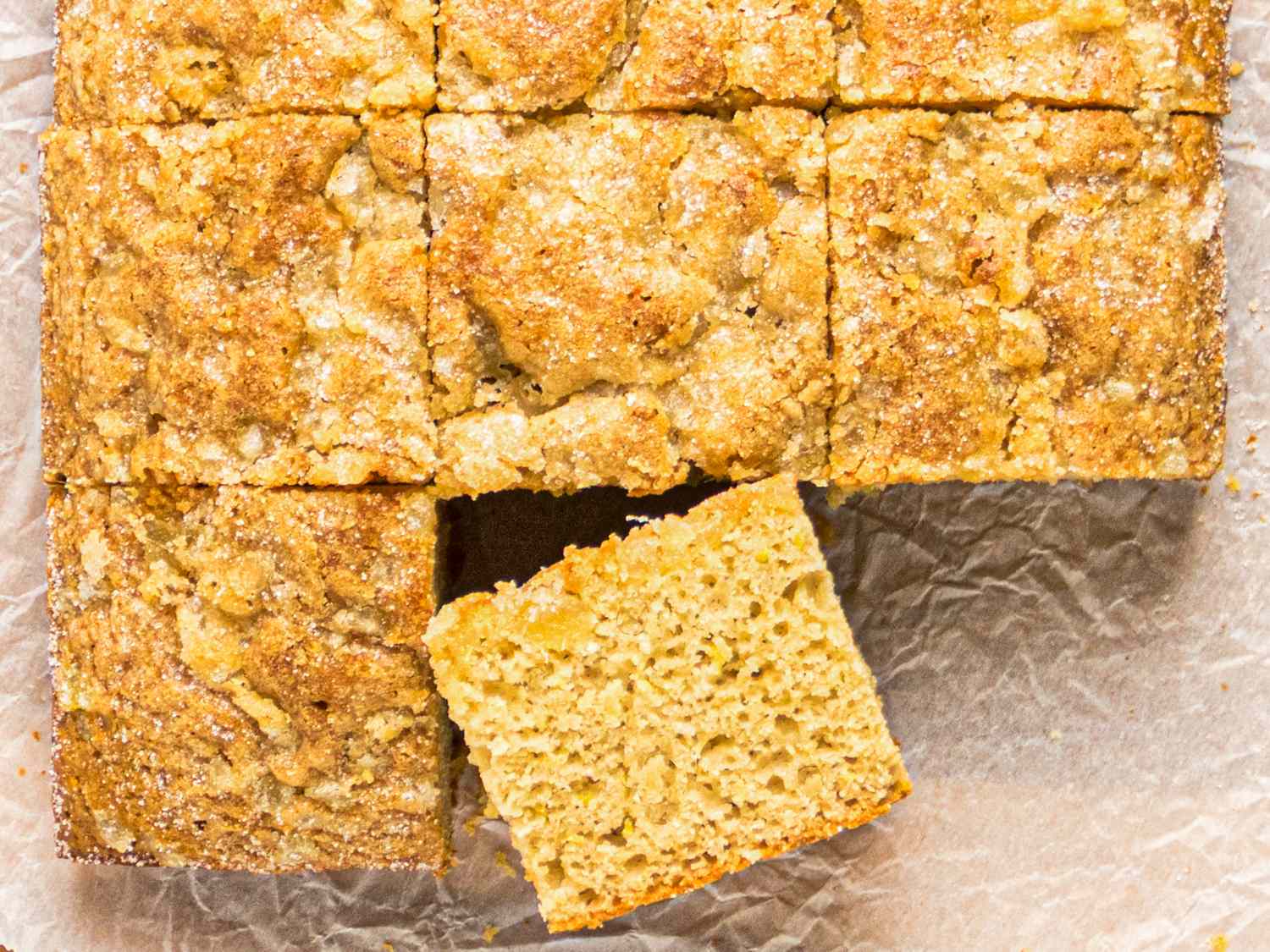 A closeup of a sliced snack cake with one piece slightly removed and placed at an angle
