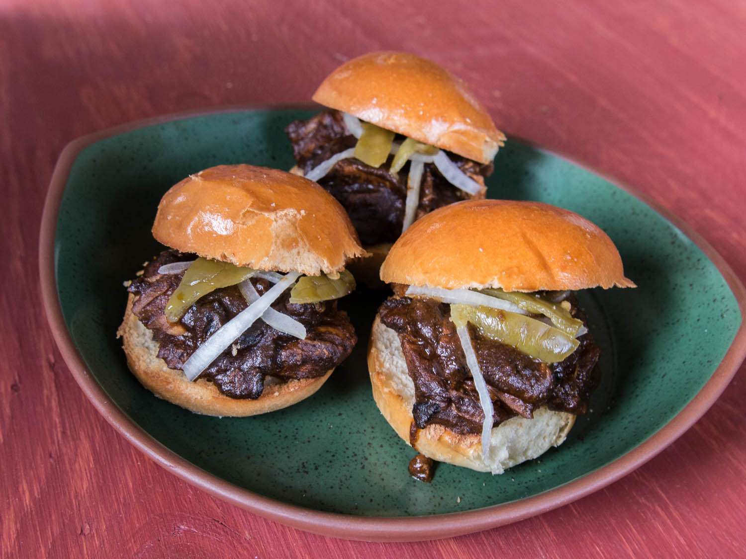 three 2-bite marinas sandwiches on a plate