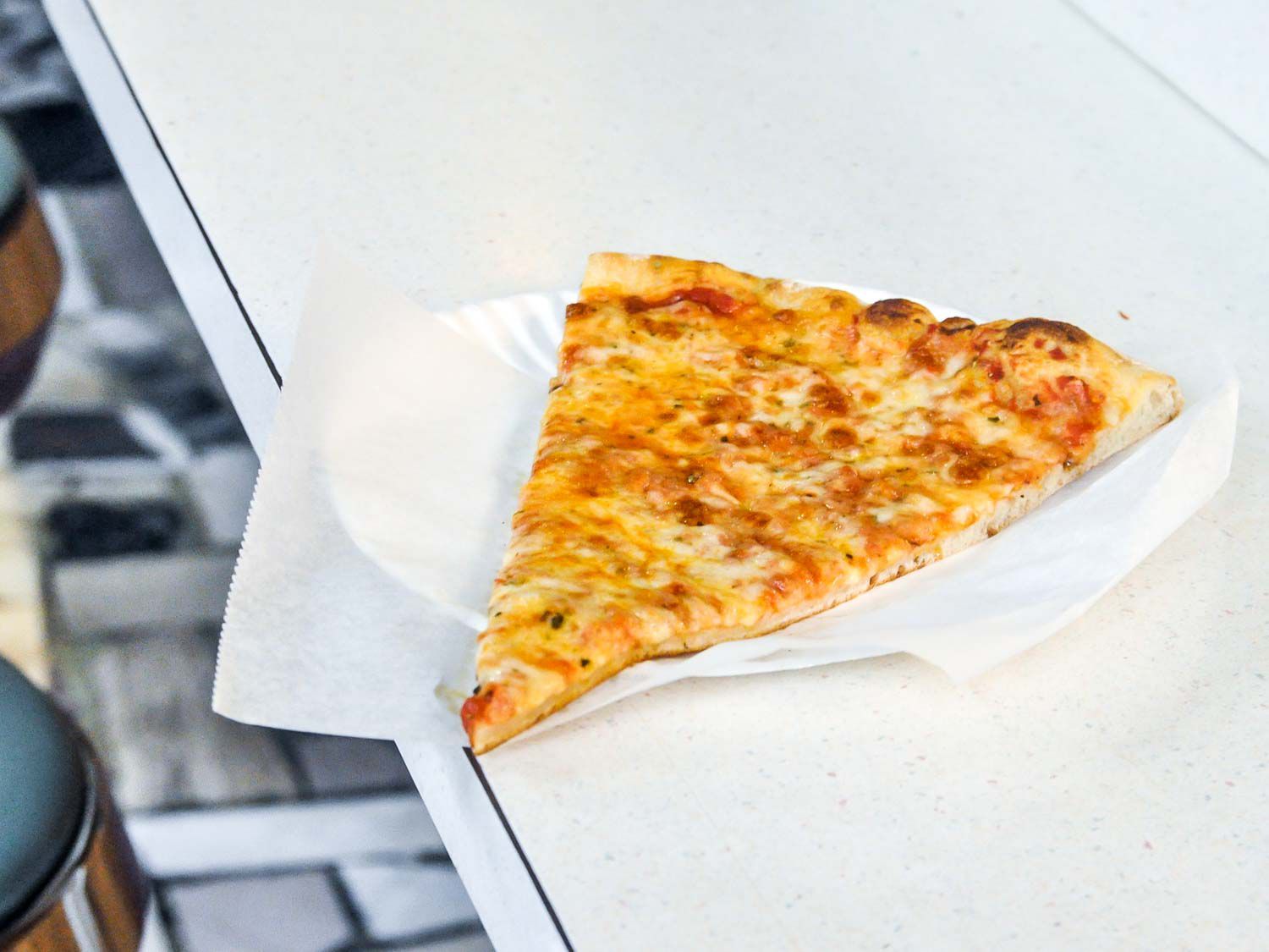 A cheese slice from J&V Pizza