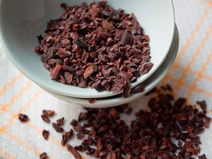 A small dish of cacao nibs. 