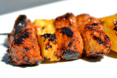 Closeup of Sweet and Spicy Apricot-Glazed Pork and Pineapple Kebabs