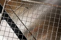 A closeup on the stainless steel racks of the Cosori food dehydrator