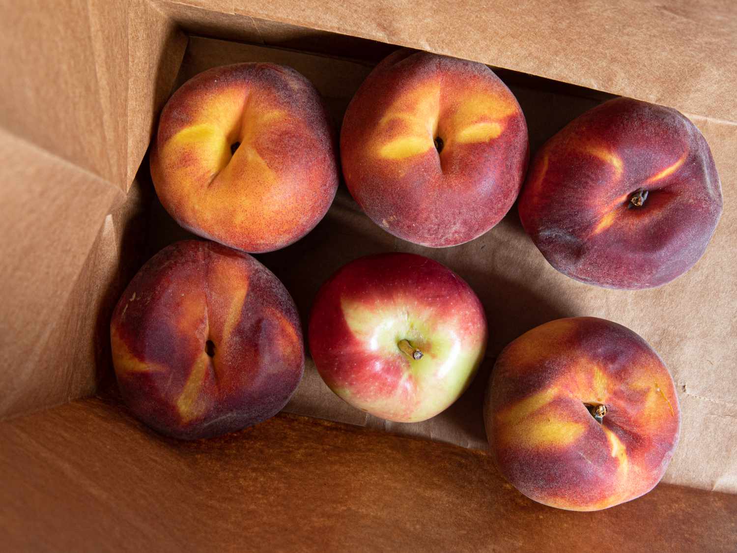 Peaches in a paper bag 