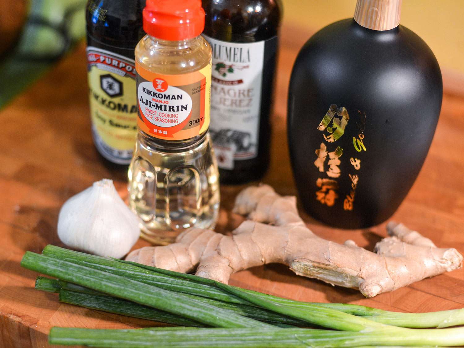 Some ingredients for the tare: soy, mirin, sherry vinegar, sake, garlic, ginger, and green onion.