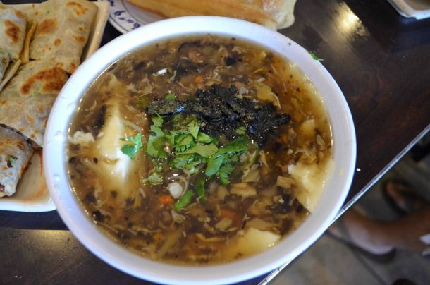 Northern Salted Soybean Milk, served in a bowl and garnished with cilantro.