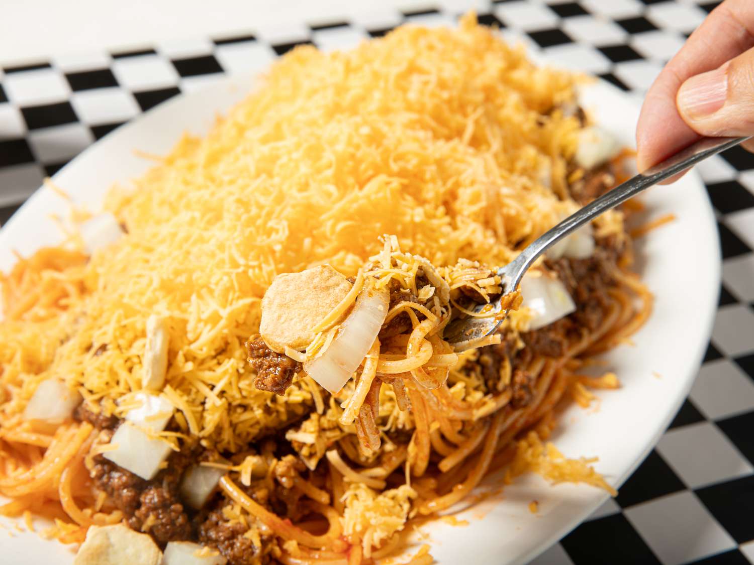 Side view of a fork eating chili