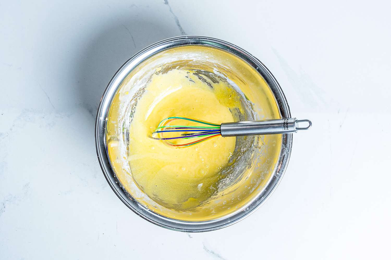 Kuhn Rikon Silicone Rainbow Whisk in a bowl