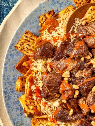 Overhead view of a half of dish of Egyptian fatta