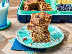 Stack of homemade protein bars on a patterned plate