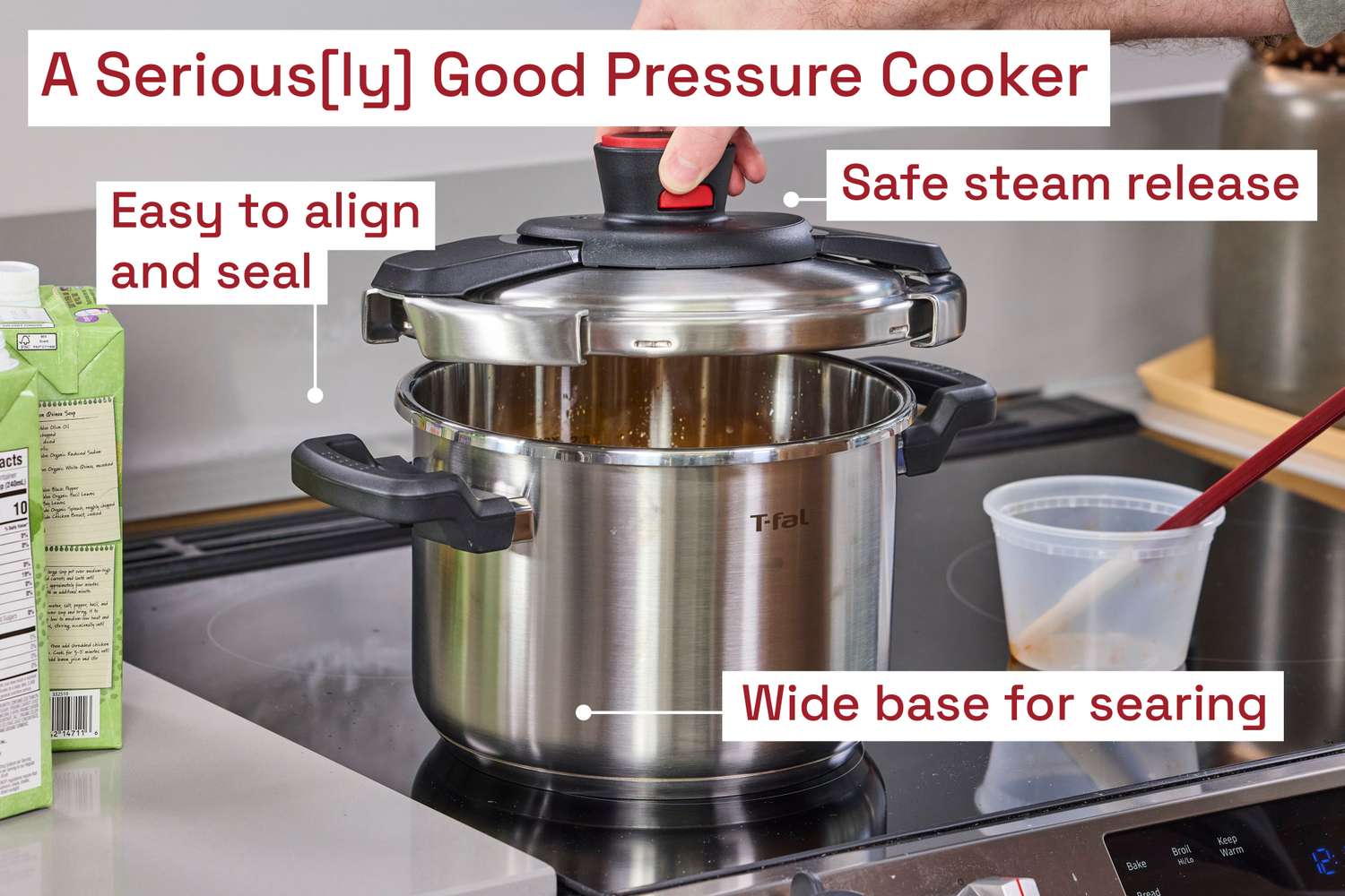 A person lifting the lid of the T-Fal Clipso Pressure Cooker