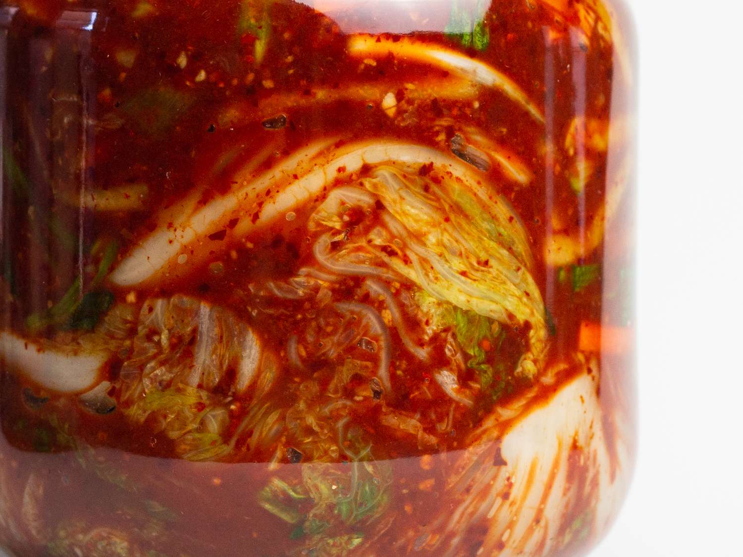 a close up of cabbage added to fermentation jar