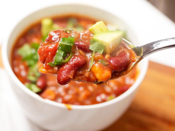 Close-up of a spoonful of vegetarian bean chili.