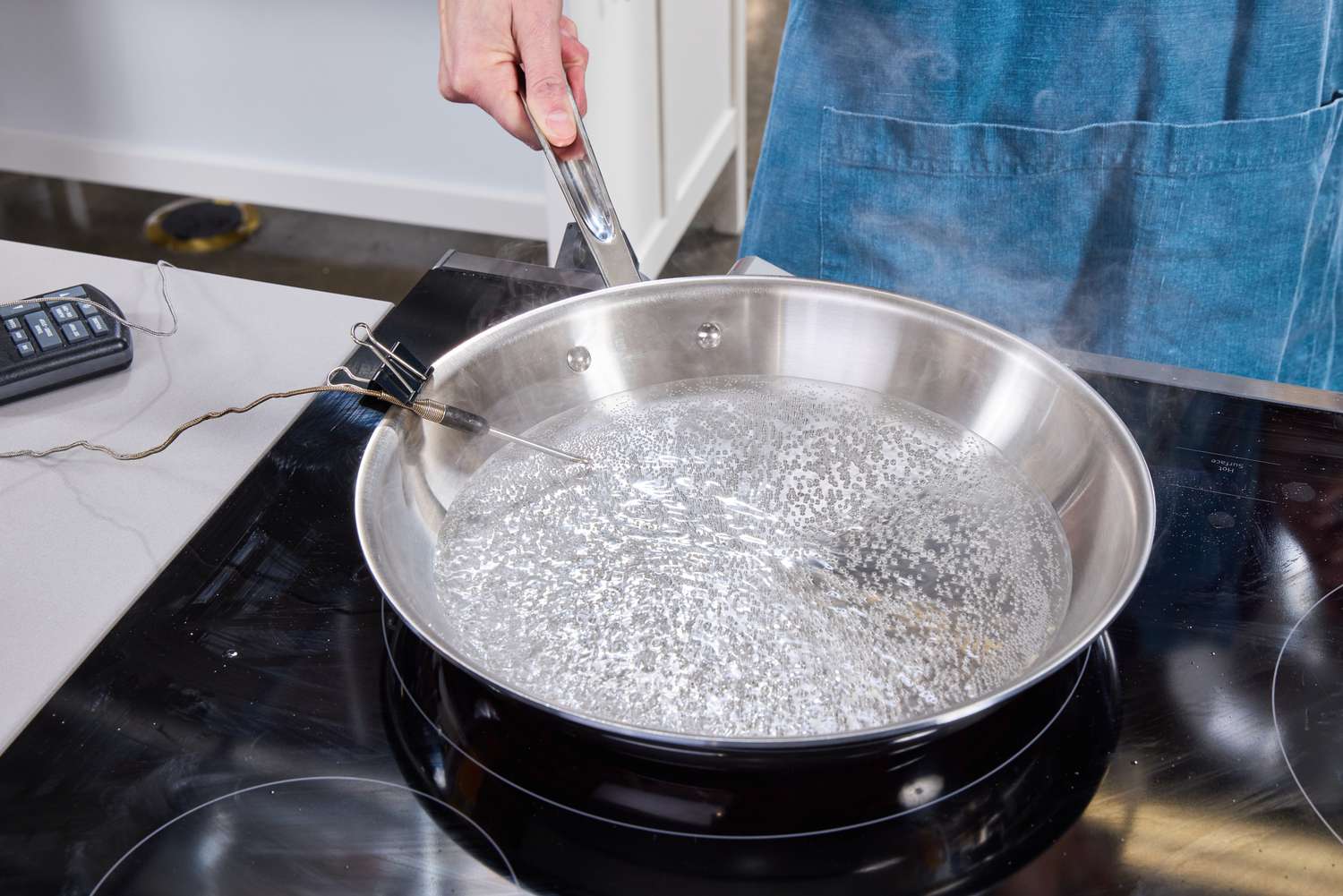 Water boiling in the All-Clad stainless steel skillet.