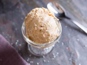A scoop of vegan salty peanut butter ice cream, an example of foods you can make with canned coconut milk. 