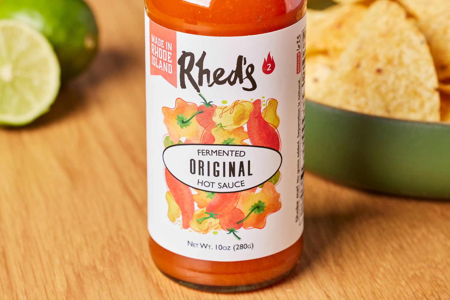 The Rhed's house sauce on a countertop with tortilla chips.