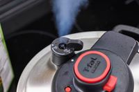 The steam valve and lock on the T-Fal Clipso Pressure Cooker lid