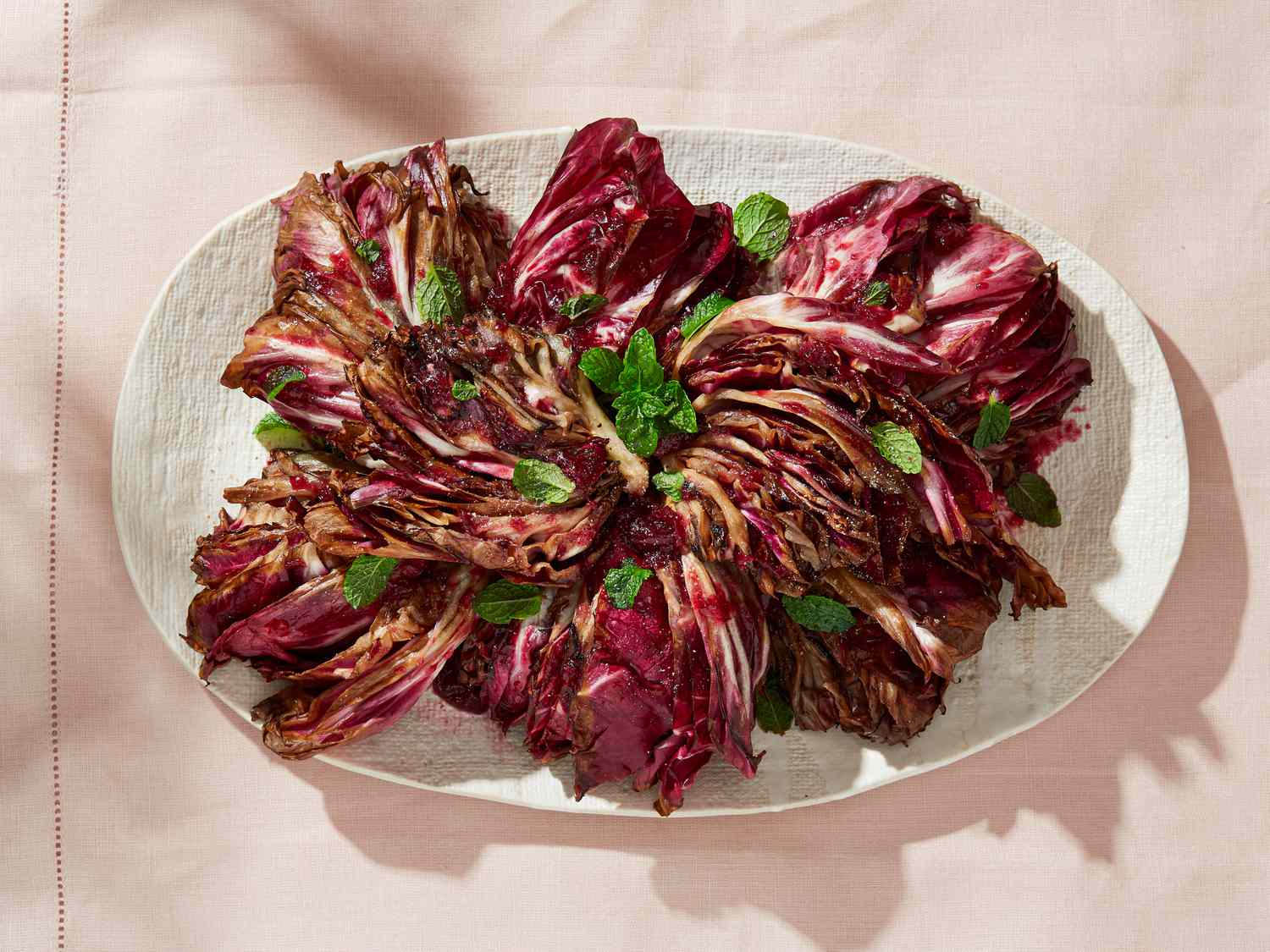 A plate of grilled radicchio with garnishes